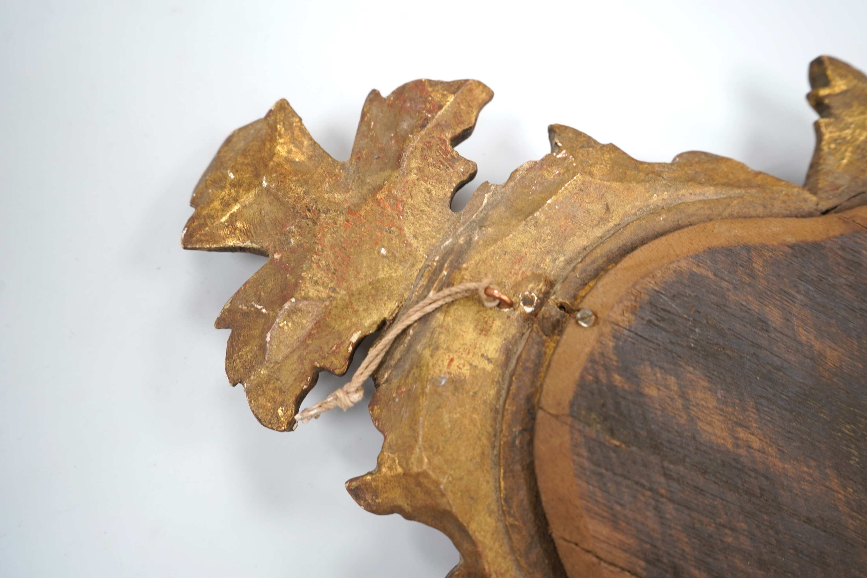 A small 19th century Italian carved giltwood mirror, 43cm high